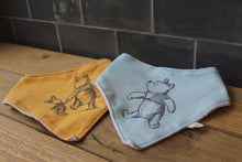Load image into Gallery viewer, Baby Bibs ~ Set of Two triangle bibs ~ Winnie the pooh ~ Pre loved
